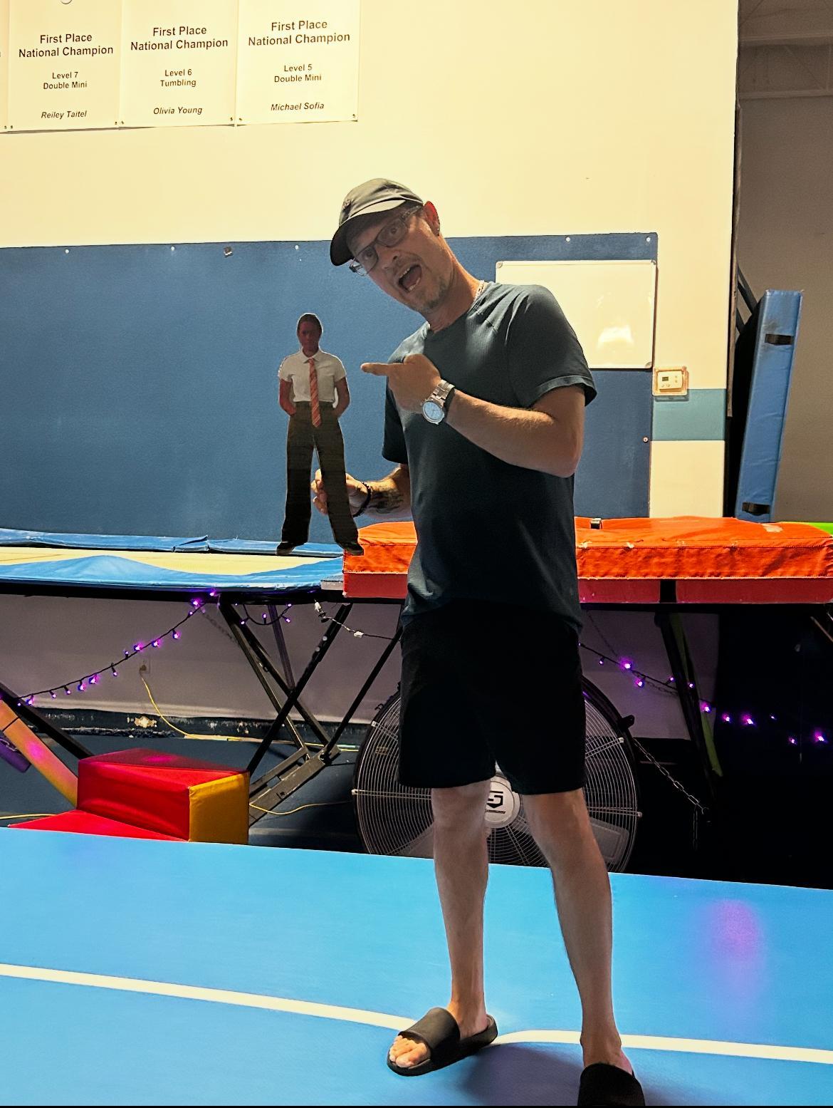 Keith holding a cardboard cut…