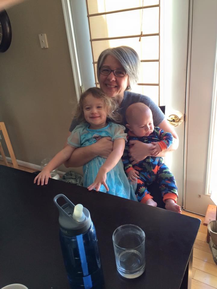 Mimi holding her grand babies…