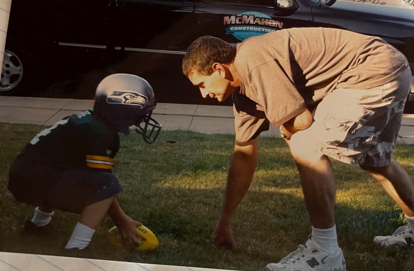 Jeff playing football with Te…