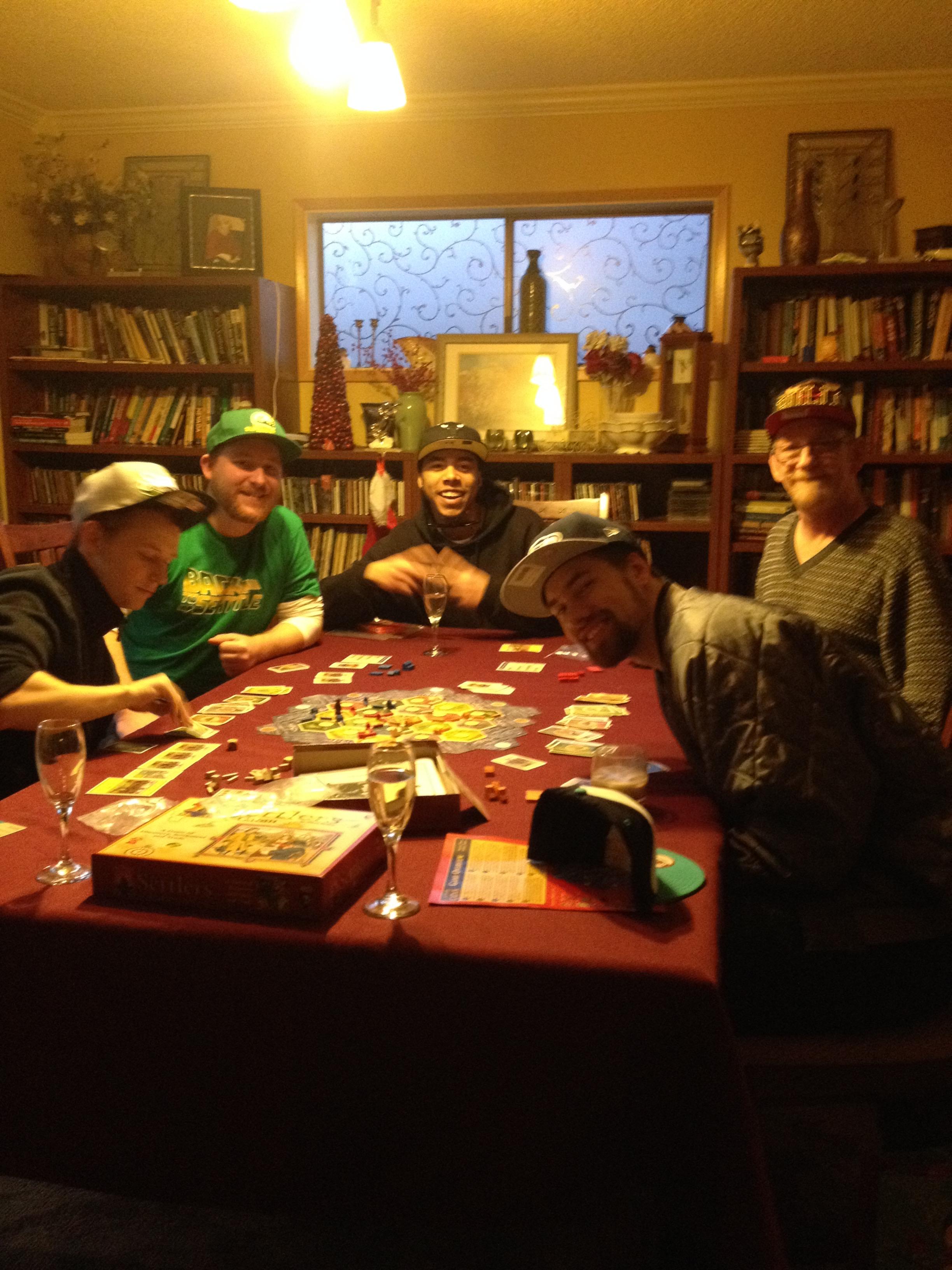 Settlers of Catan with sons a…