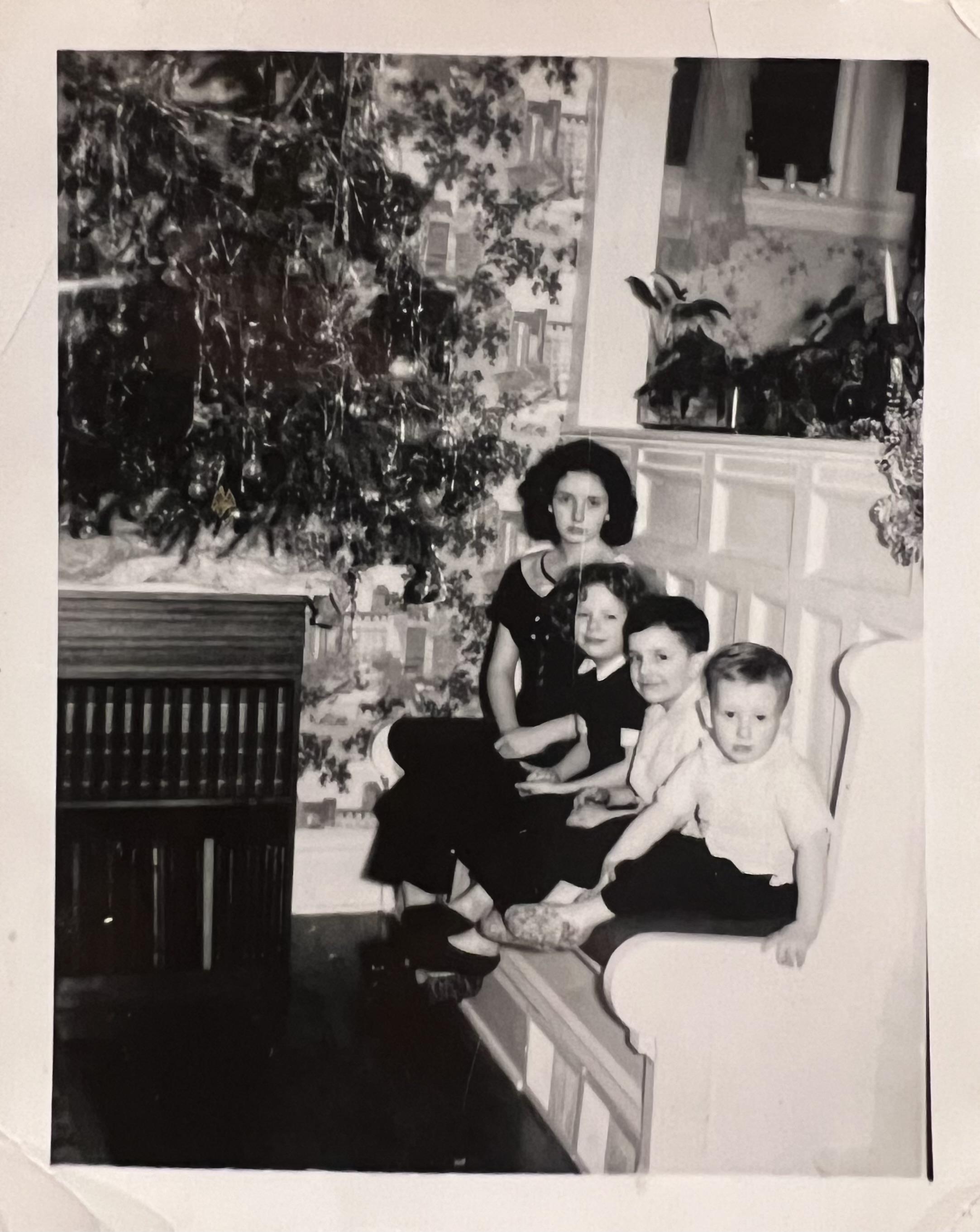 With his sisters and brother