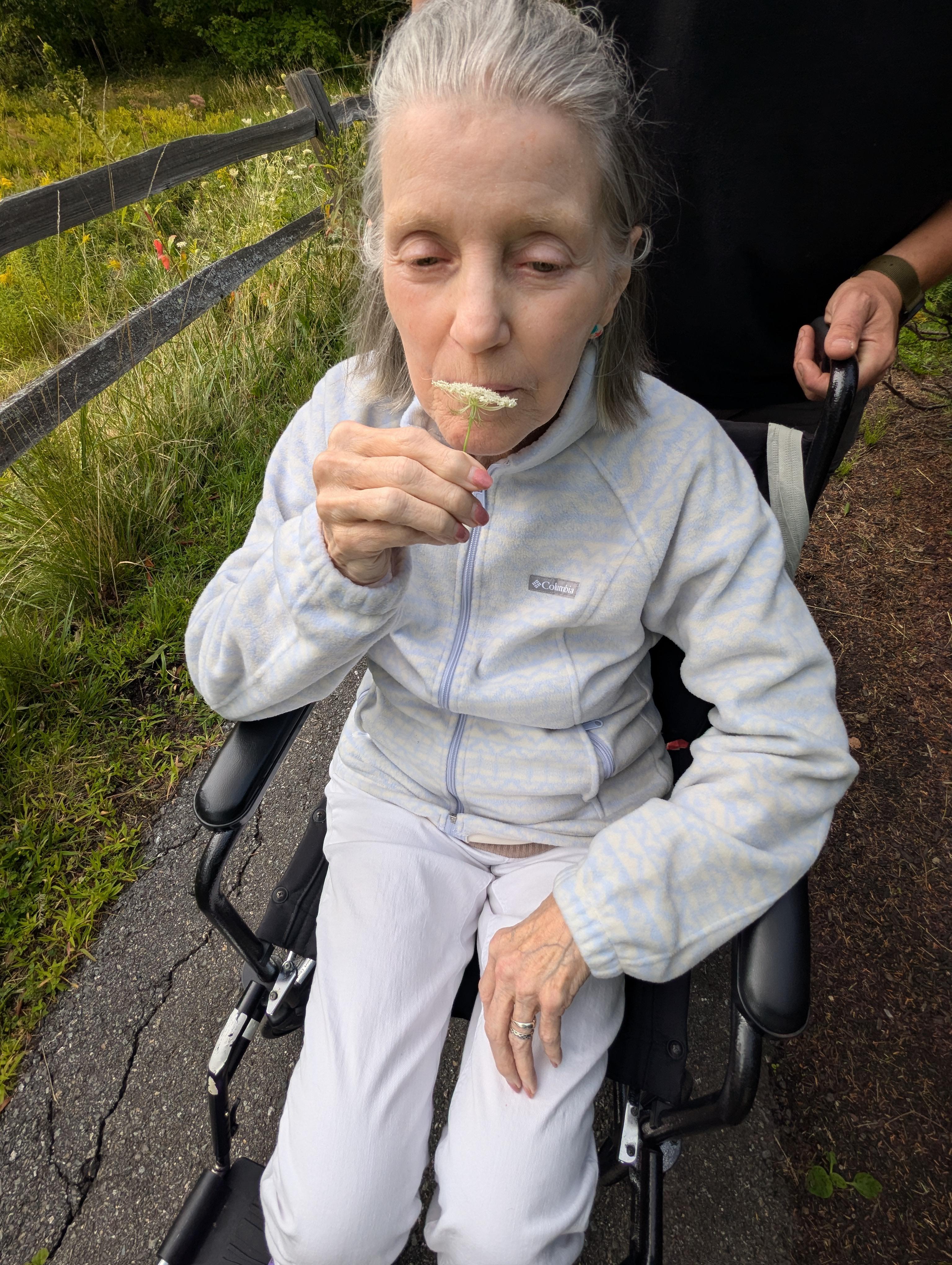 Mom smelling the flower