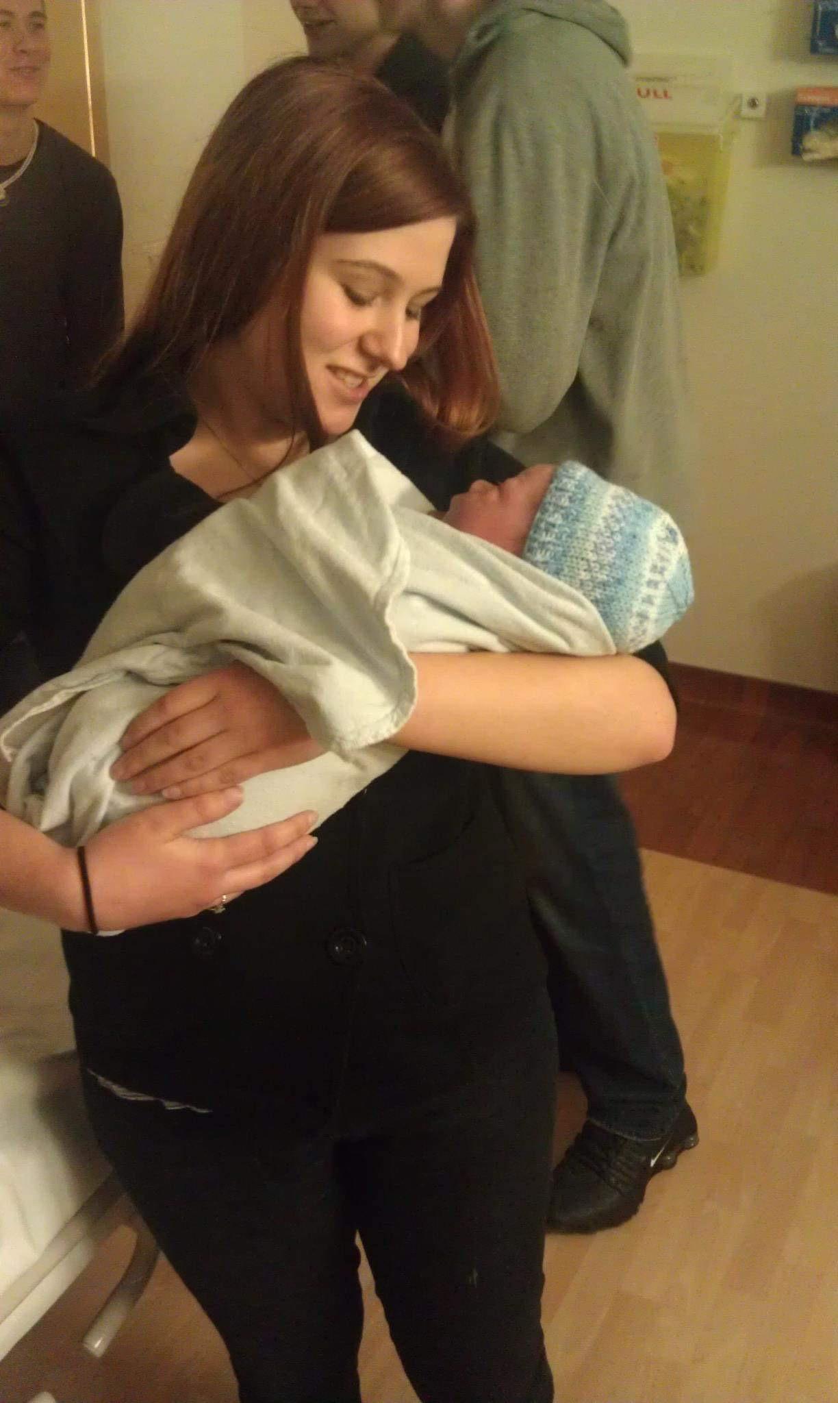 Holding newborn Oliver “Ollie”