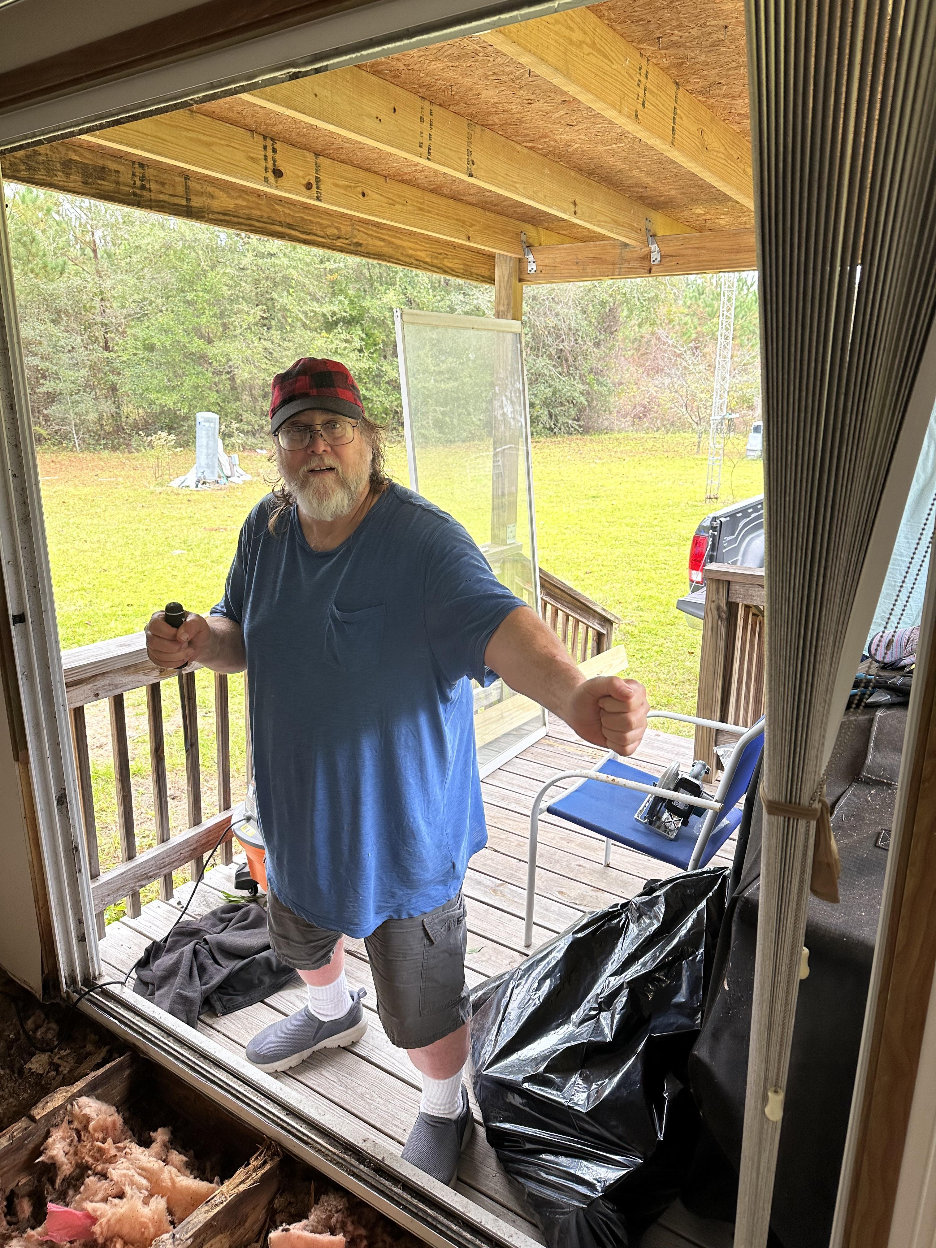 Tom doing house repairs