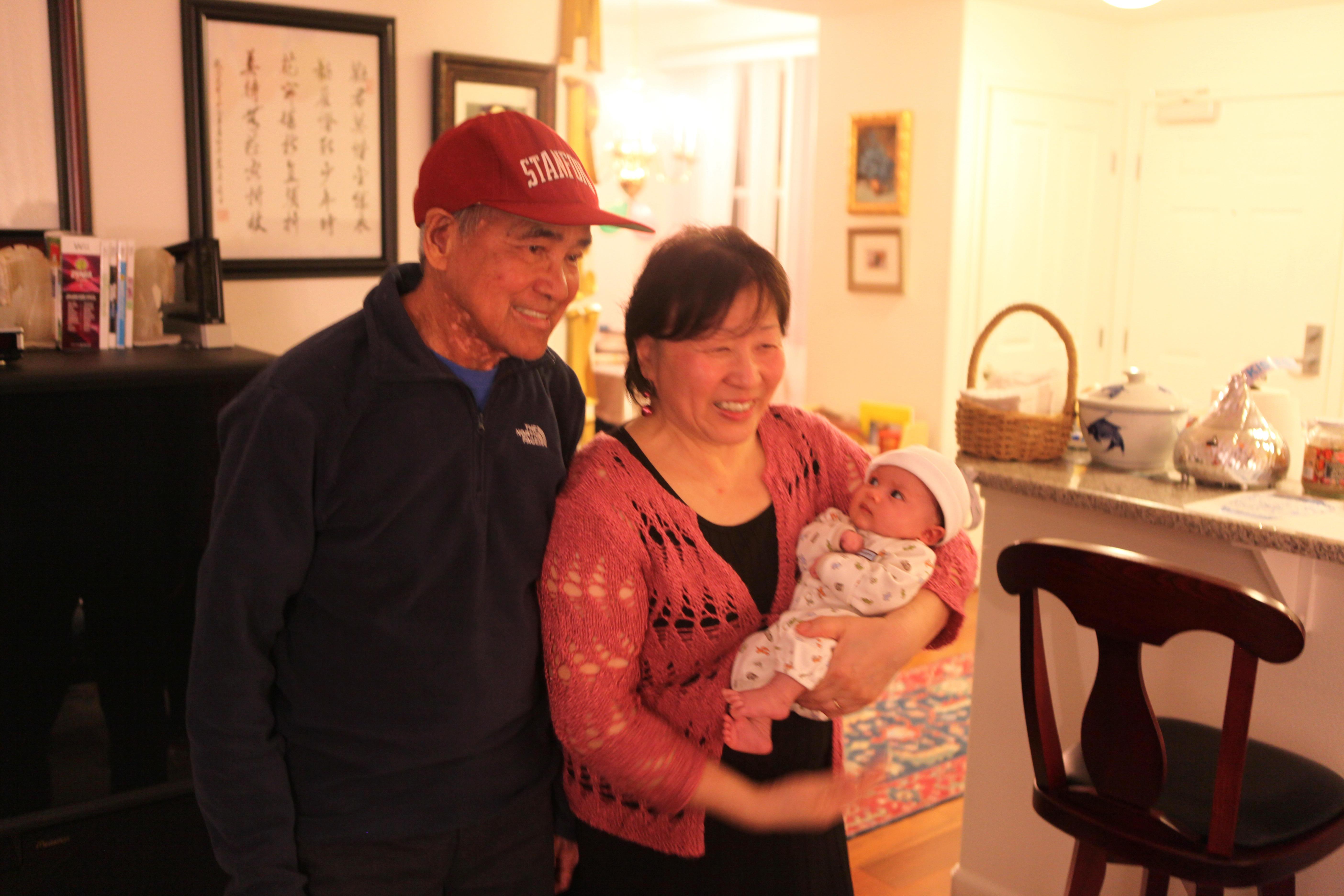 Proud grandparents with young…