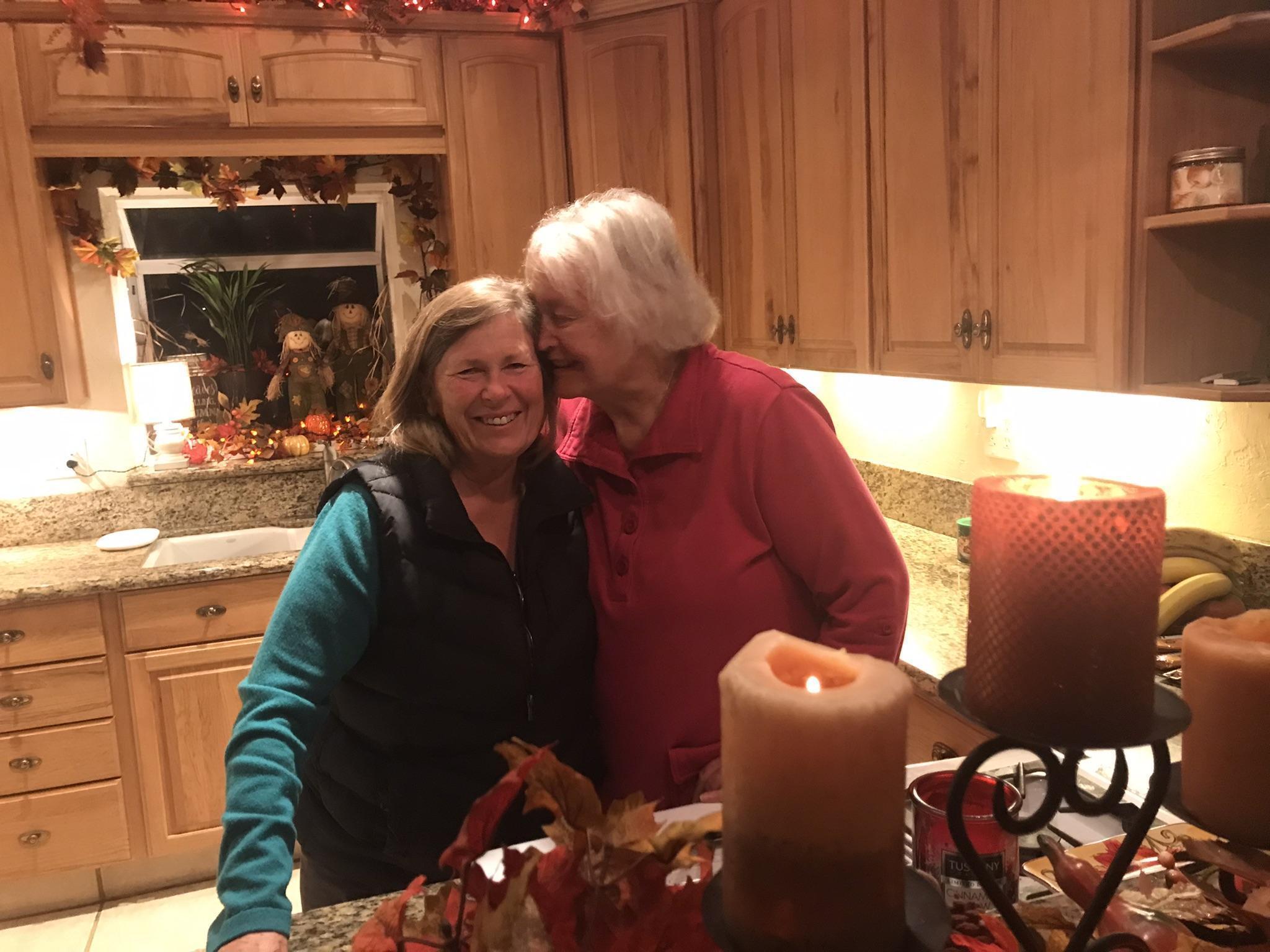 Maryann telling Lyn a secret