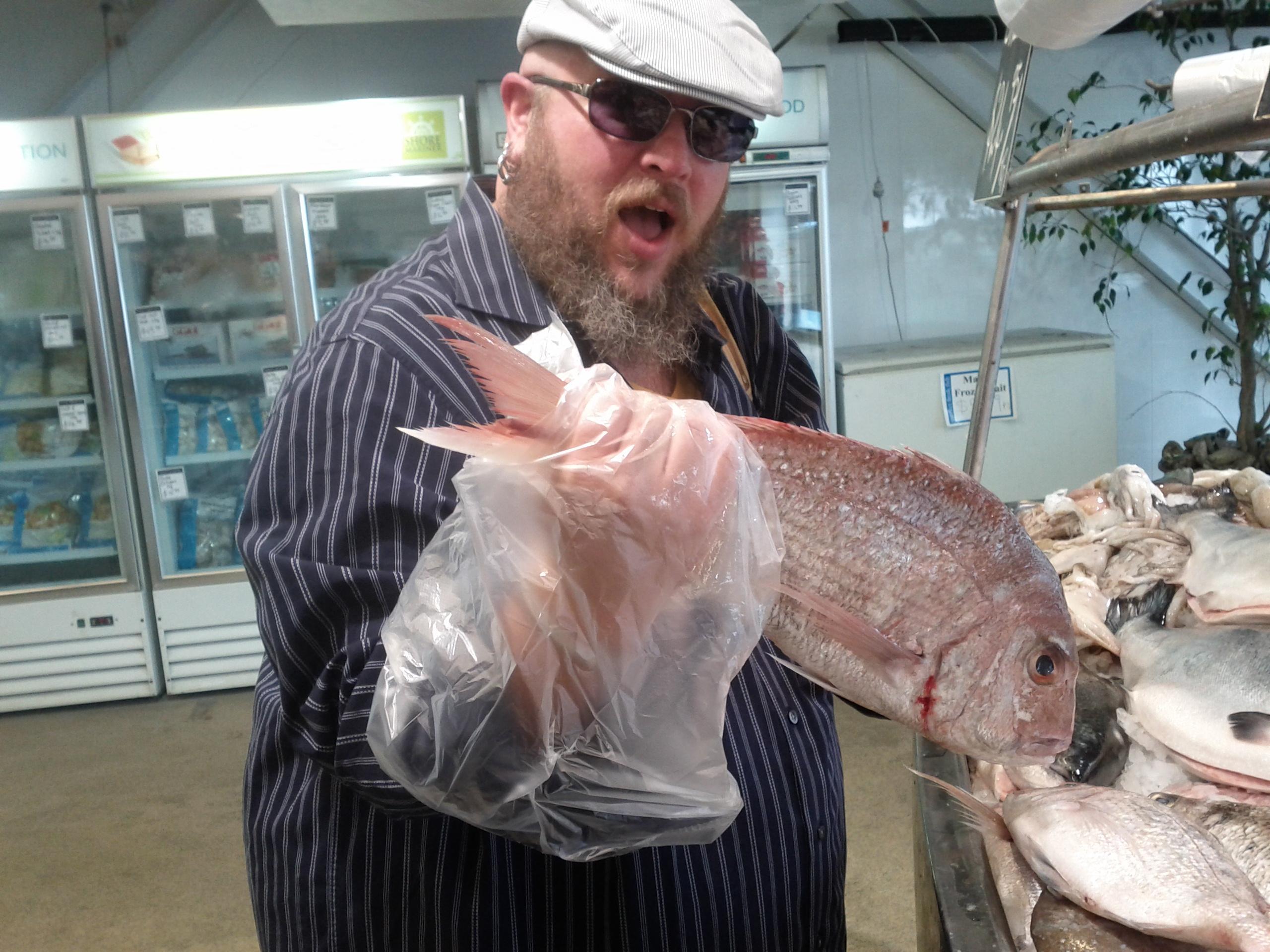 Colin picking up fish he has …