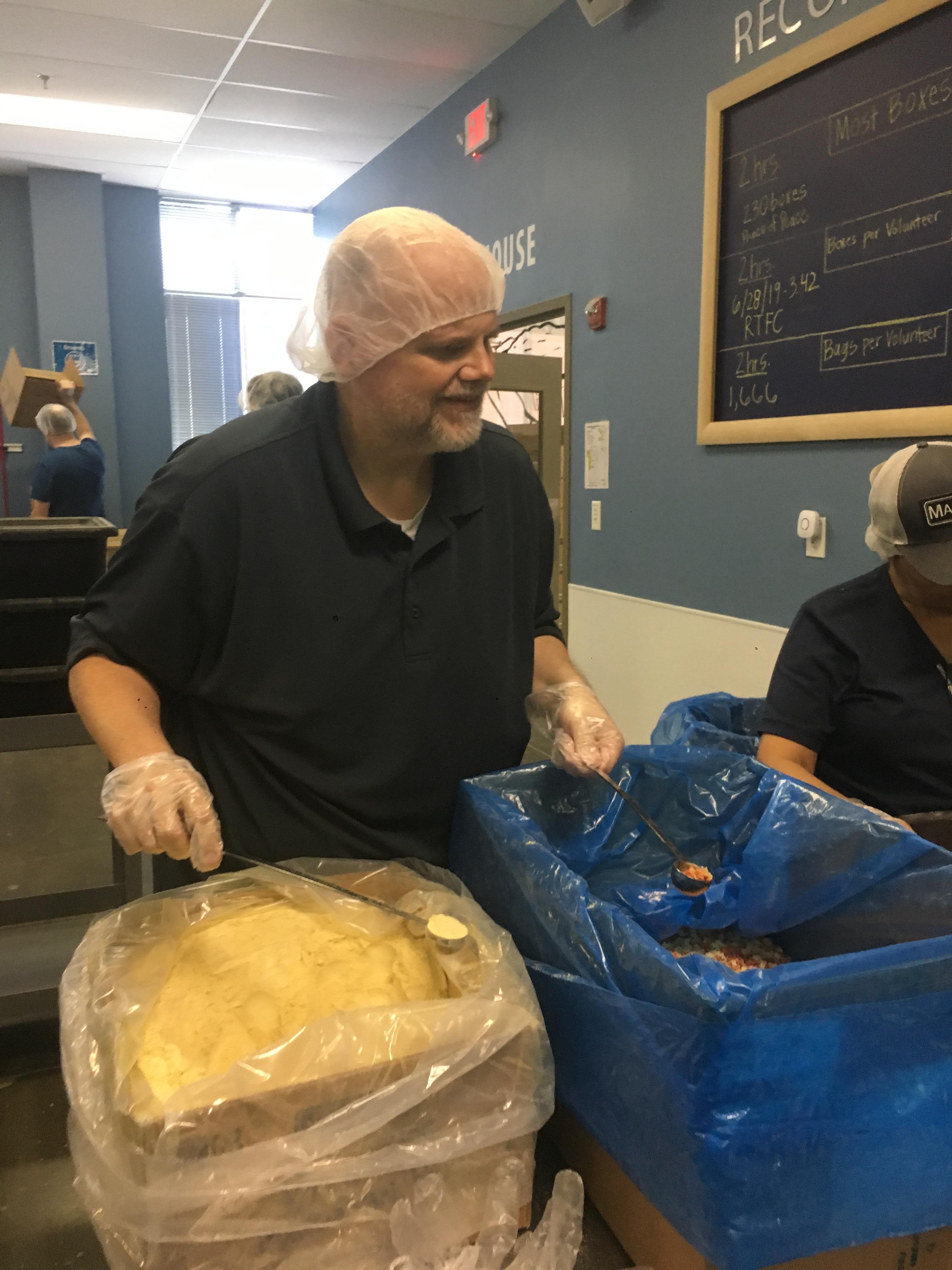 Smiling as he is packaging up…