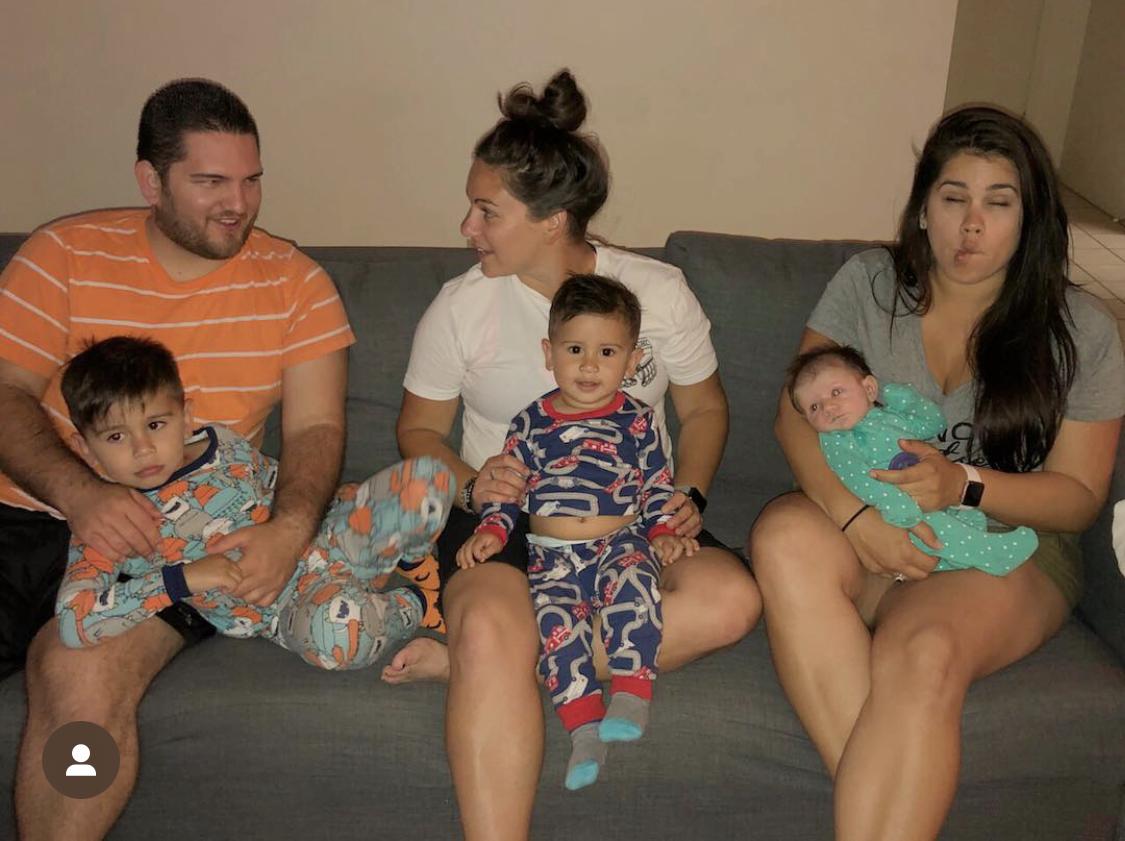 Michael holding Nixon, Jenn h…