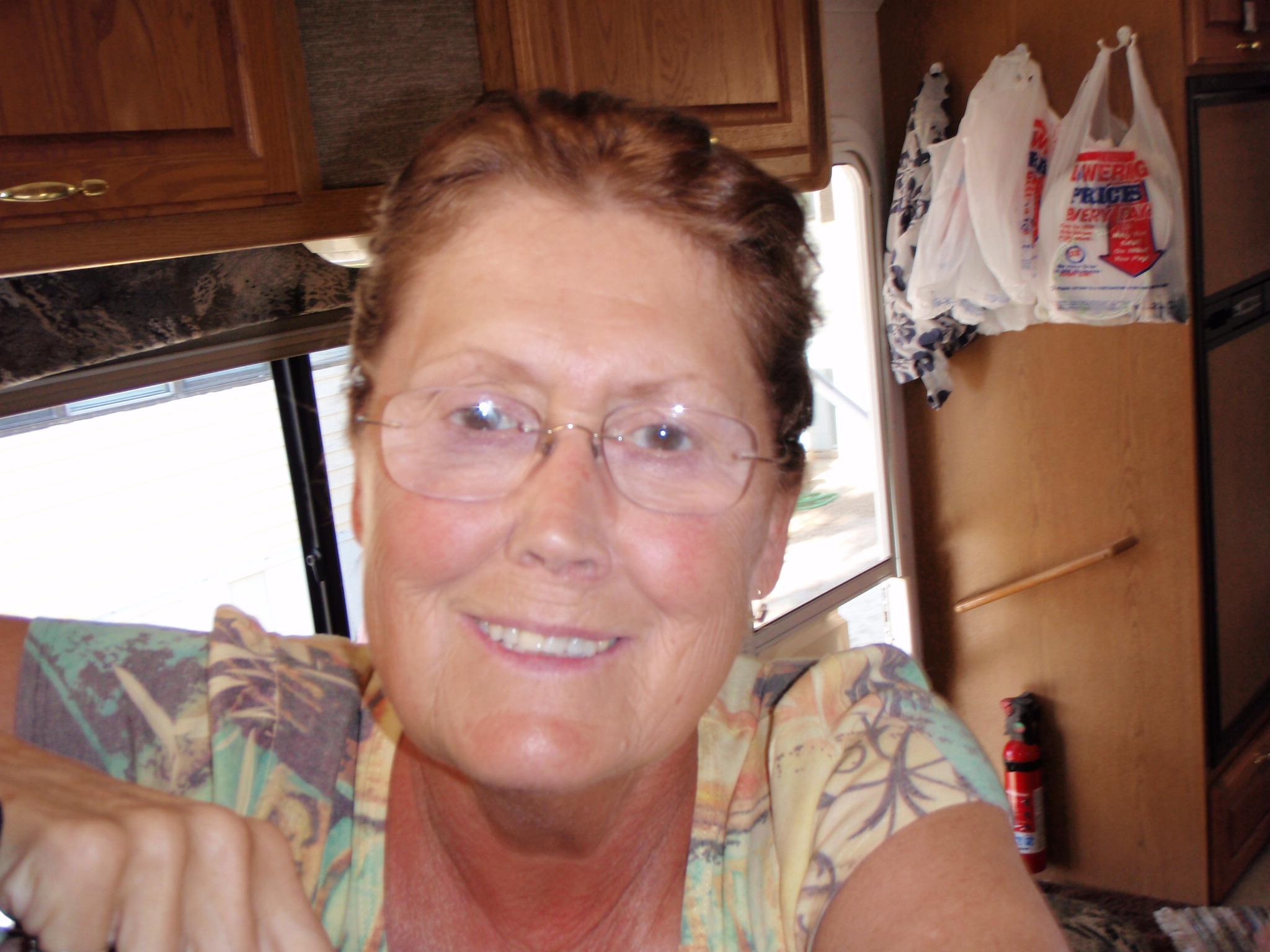 Happy Kathy in the motor home.