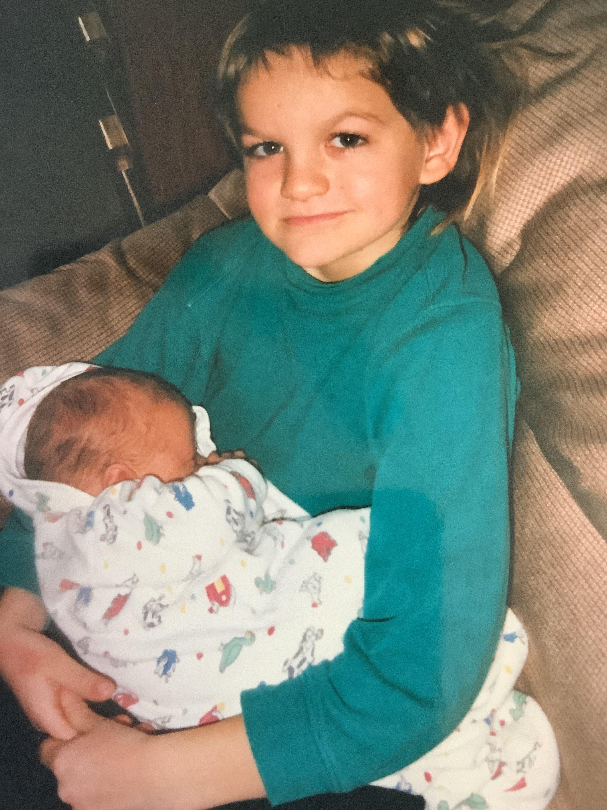 Tyler with his new baby broth…