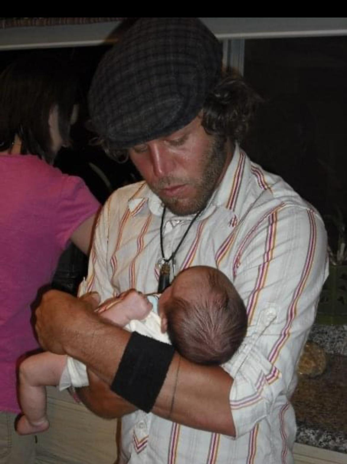 Uncle Davey holding Baby Lucy