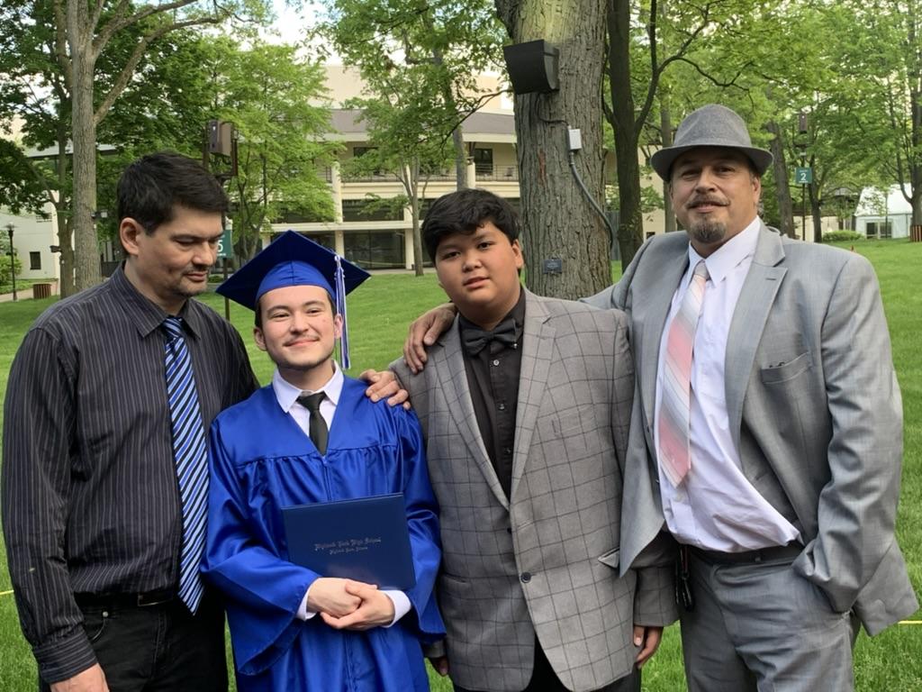 HS Graduation with his dad, c…