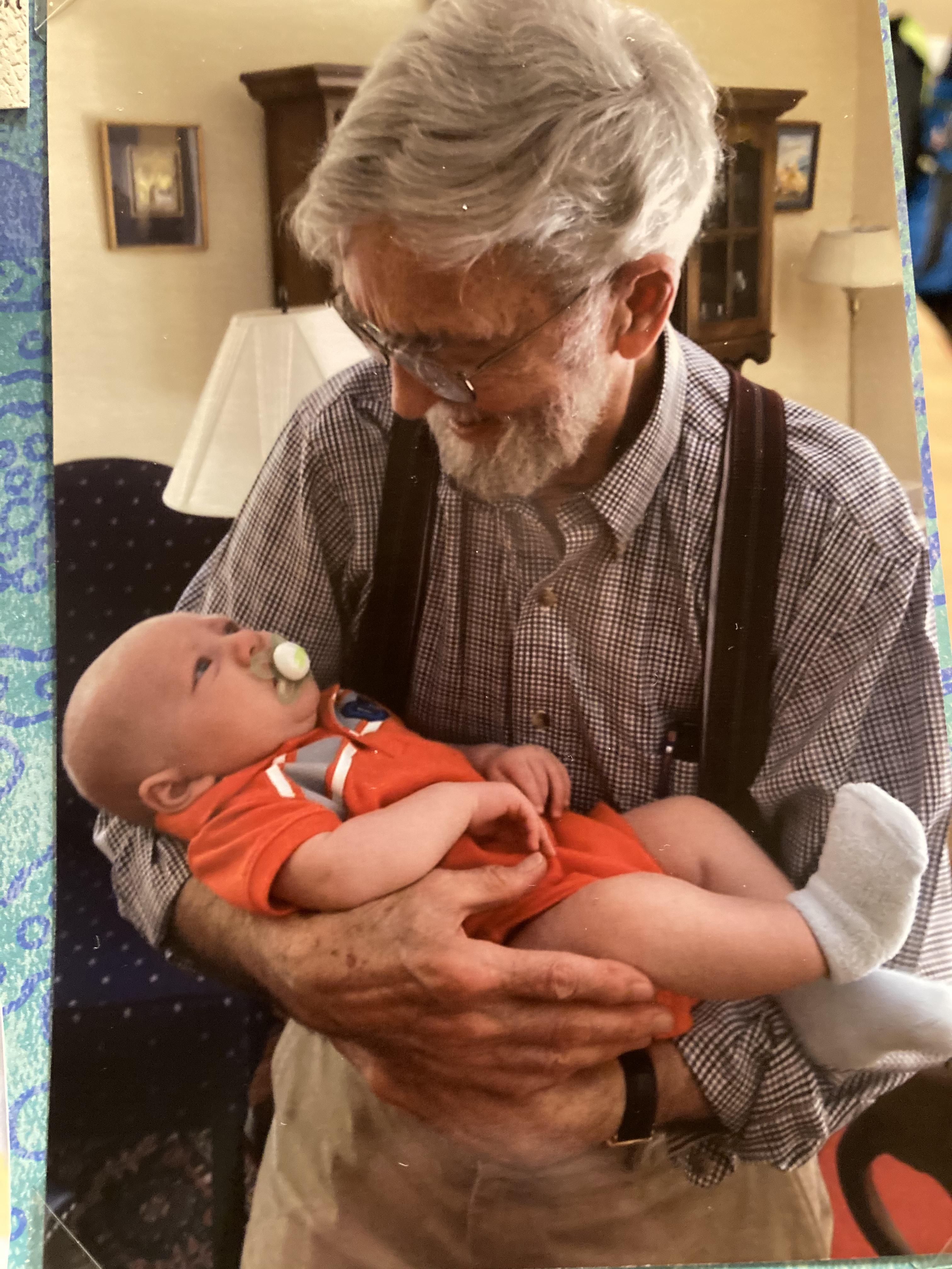 Holding his great grandson Ha…