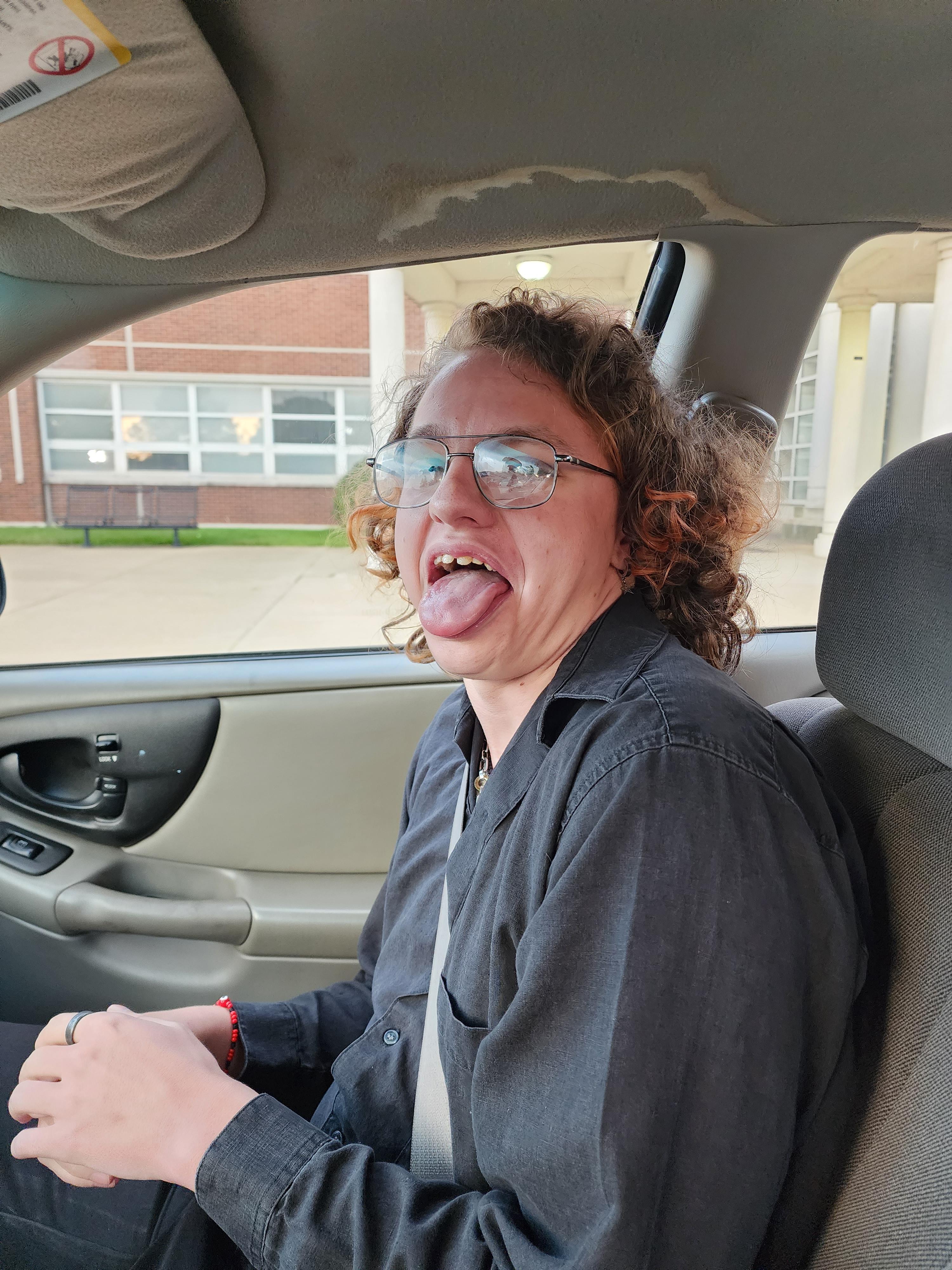 in the car outside of the hig…