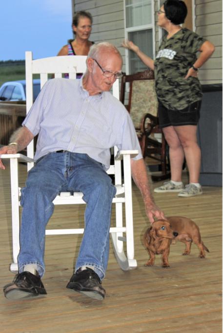 Richard playing with a dog