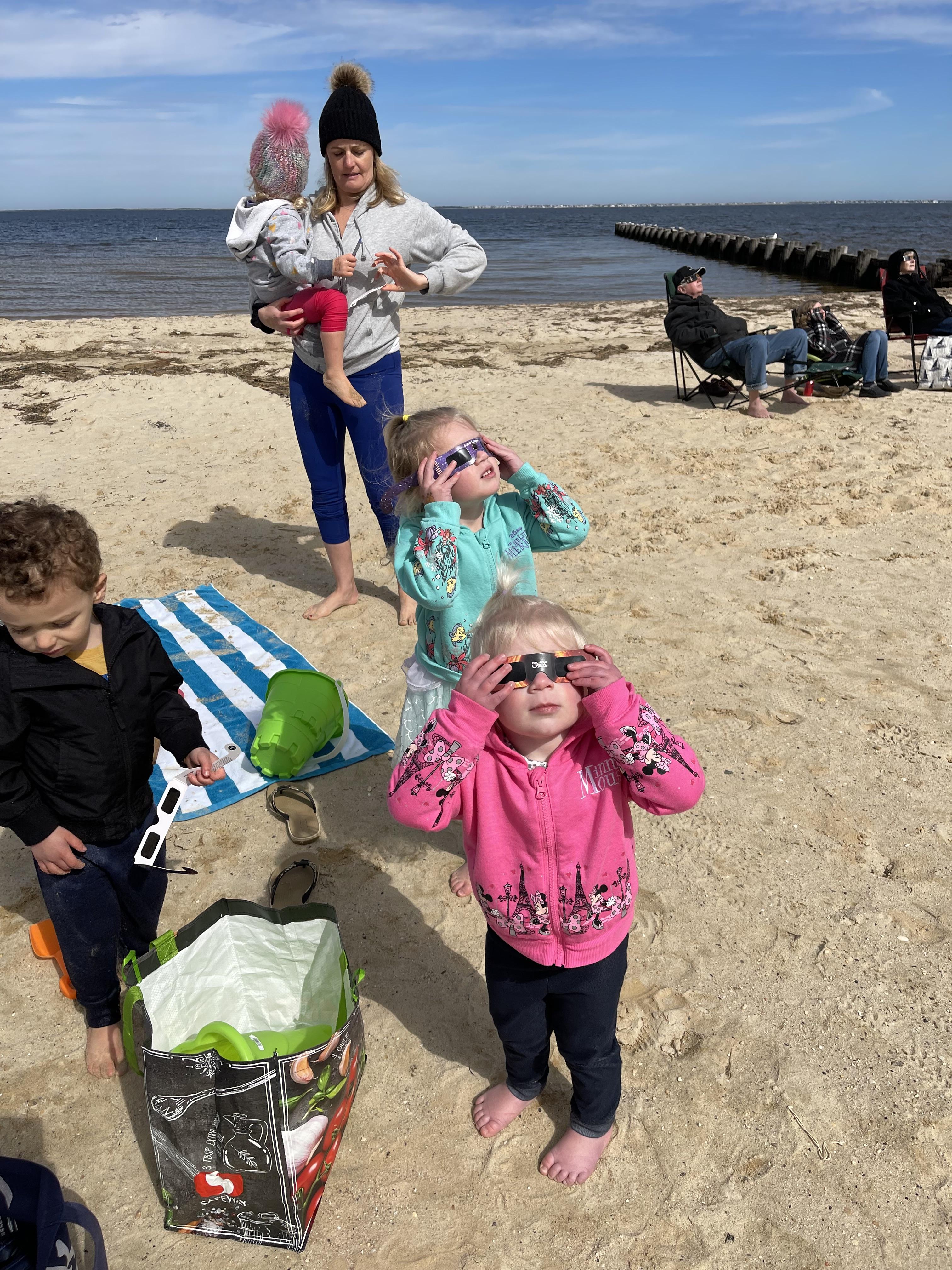 Solar eclipse at the bay beach