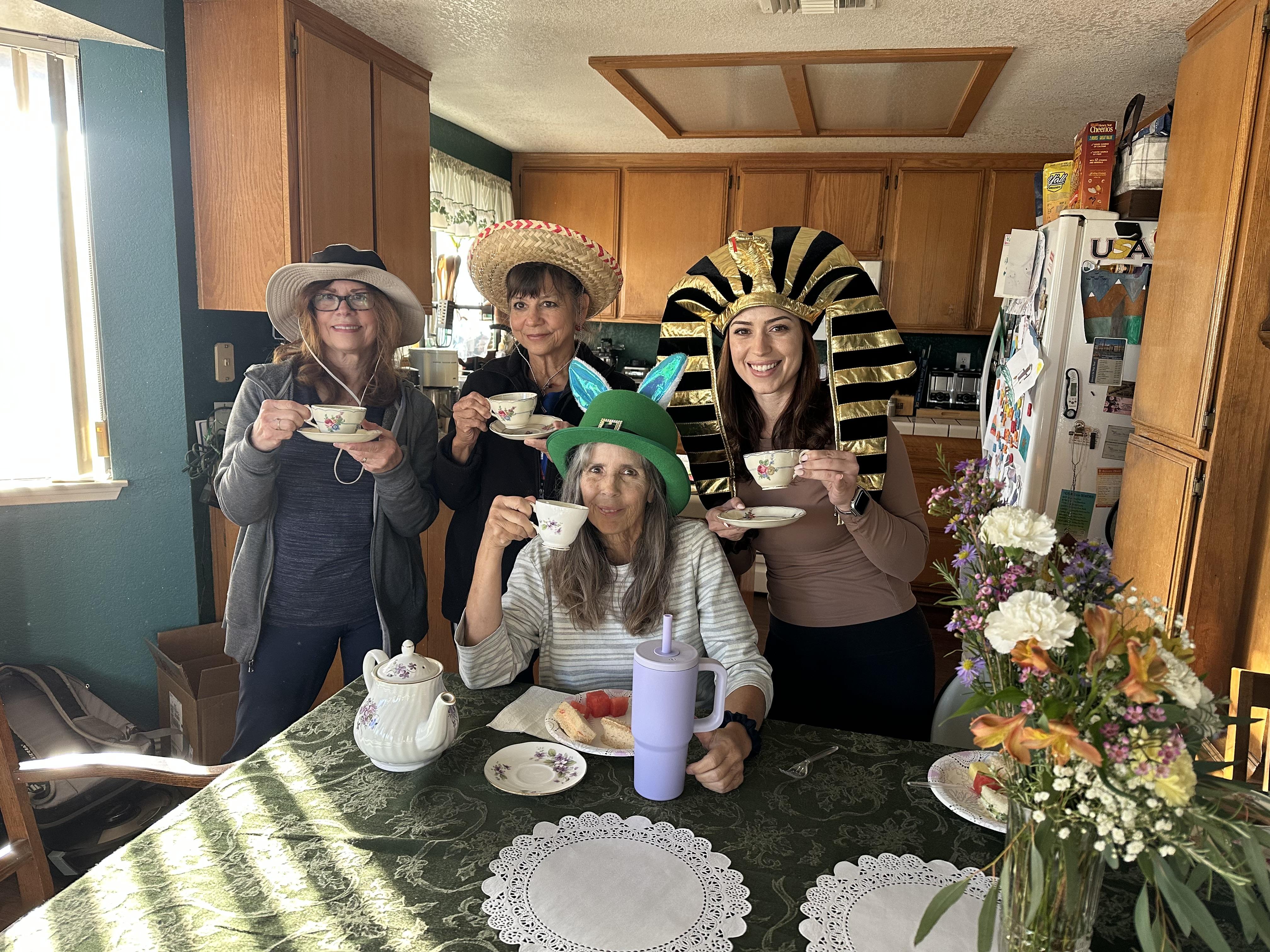Fancy hat tea party with fami…