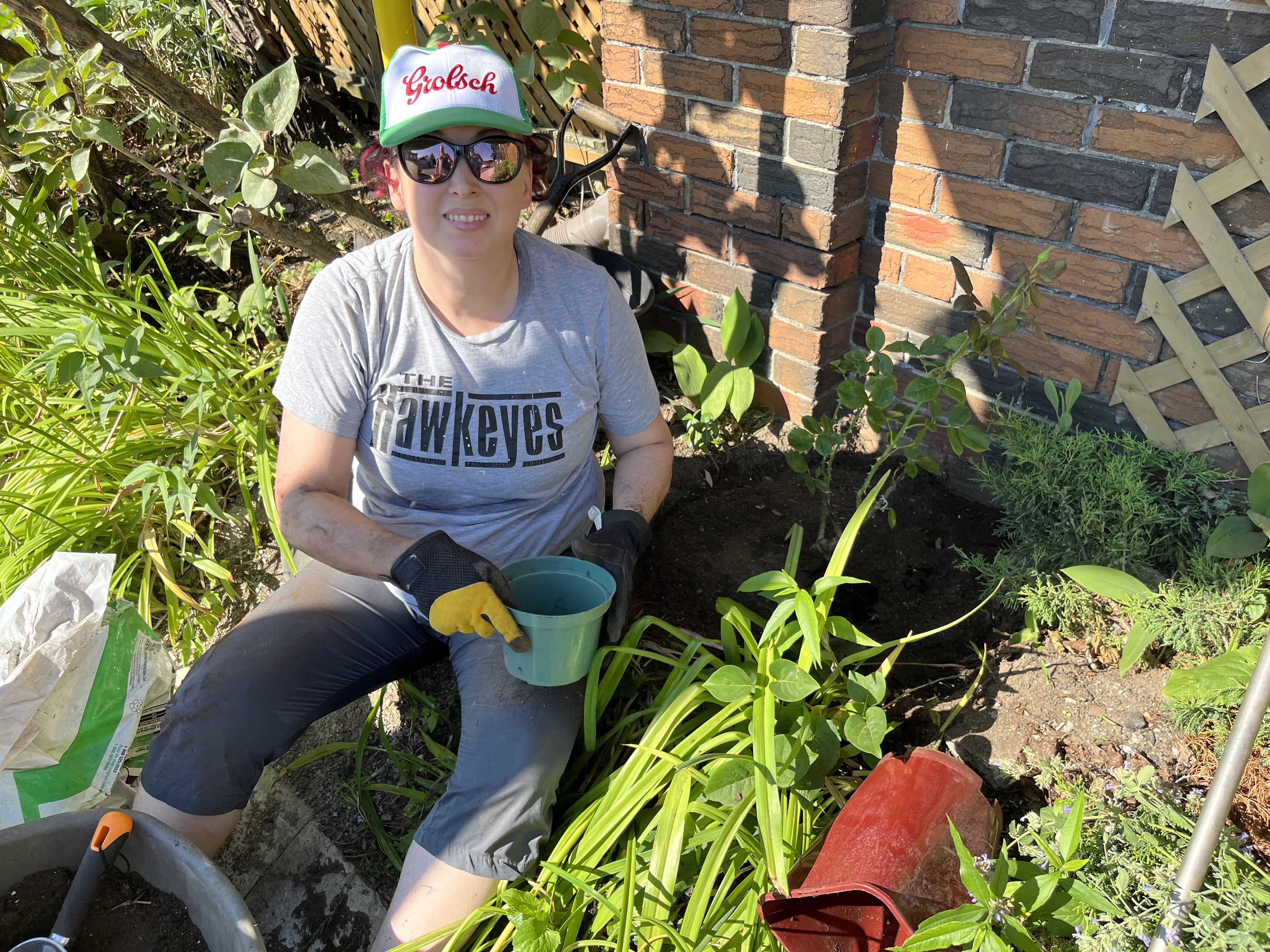 Julia planting her new rose b…