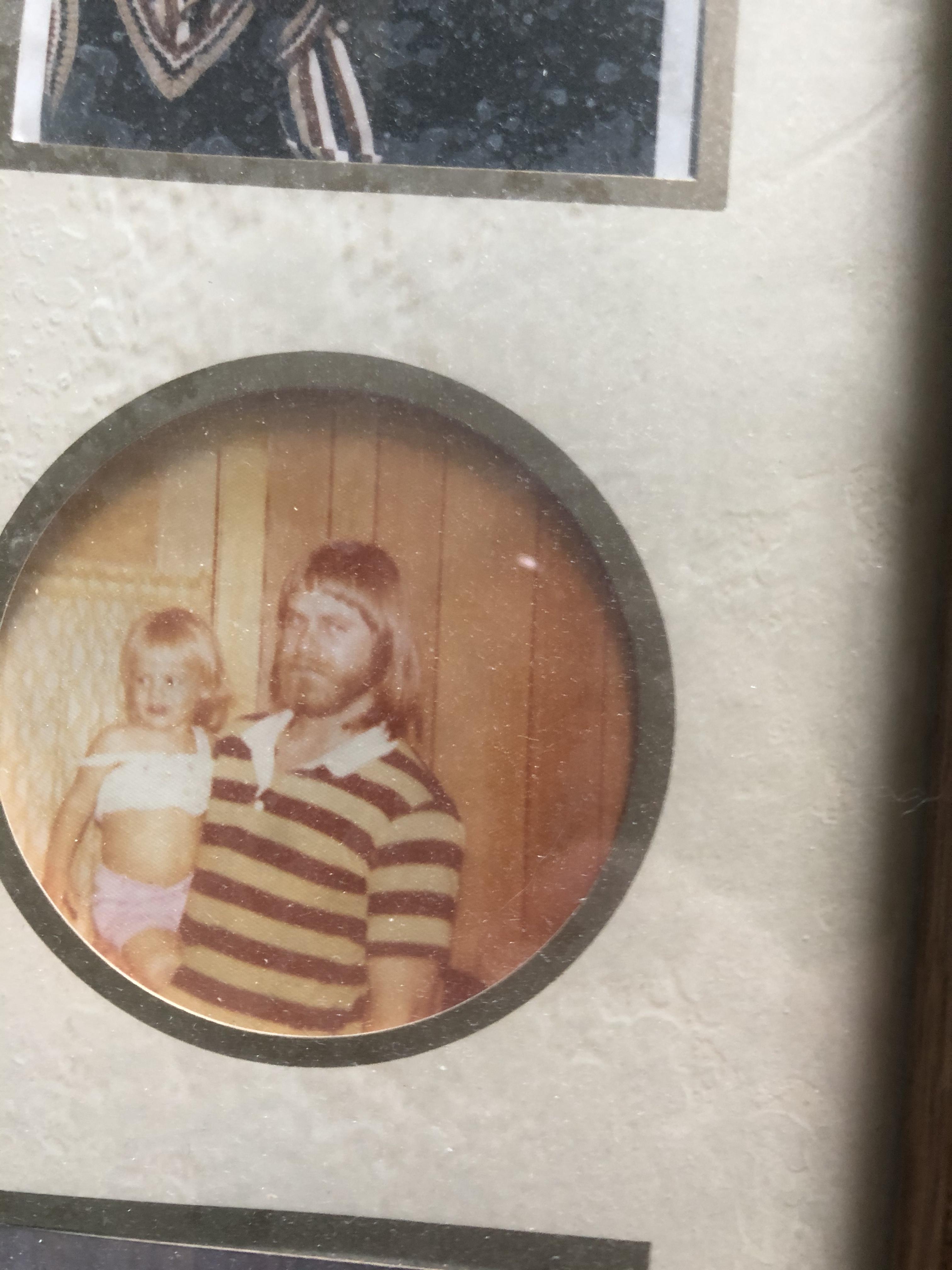 Proud dad, holding his girl.