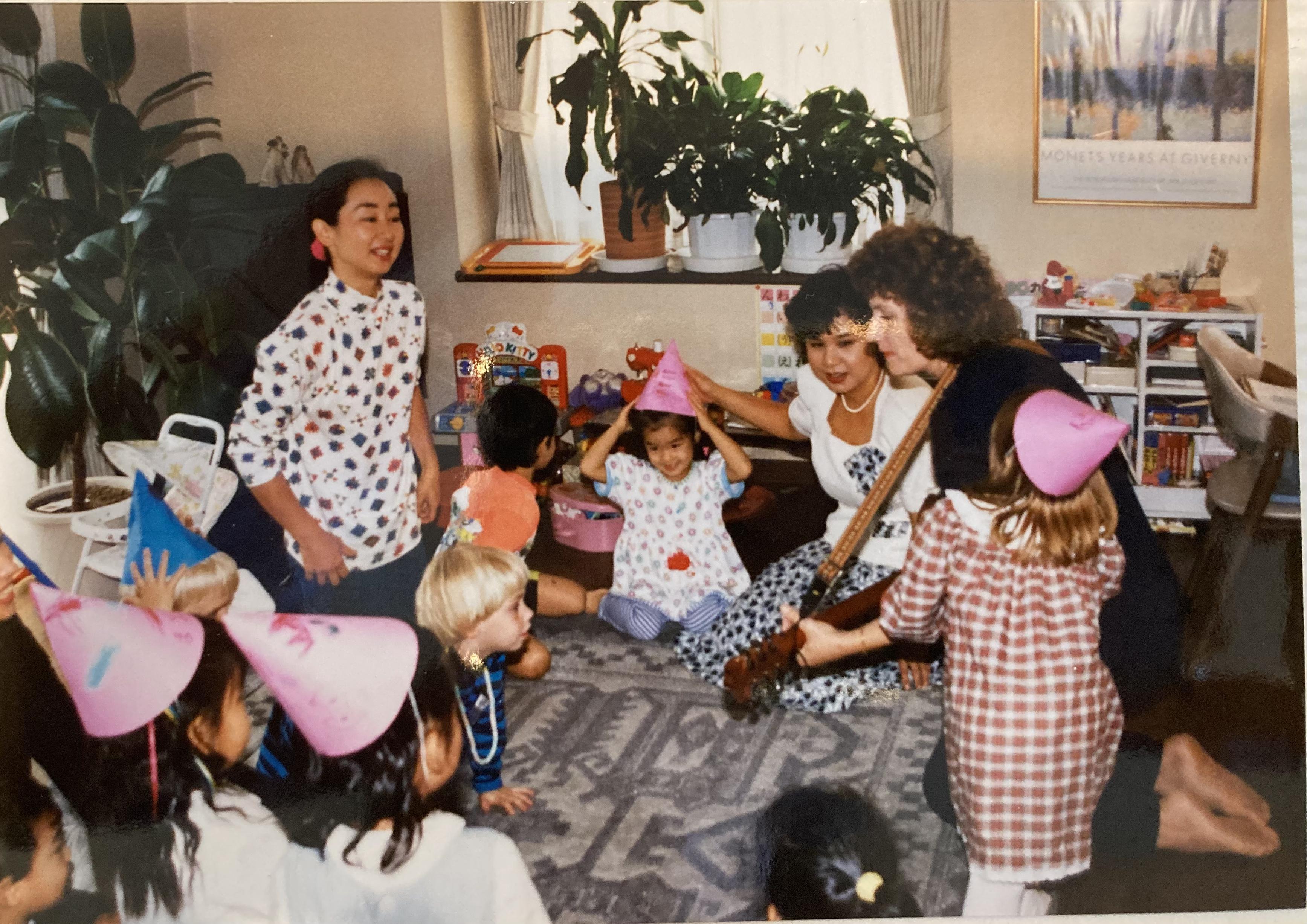 Kathy playing  guitar at Akik…