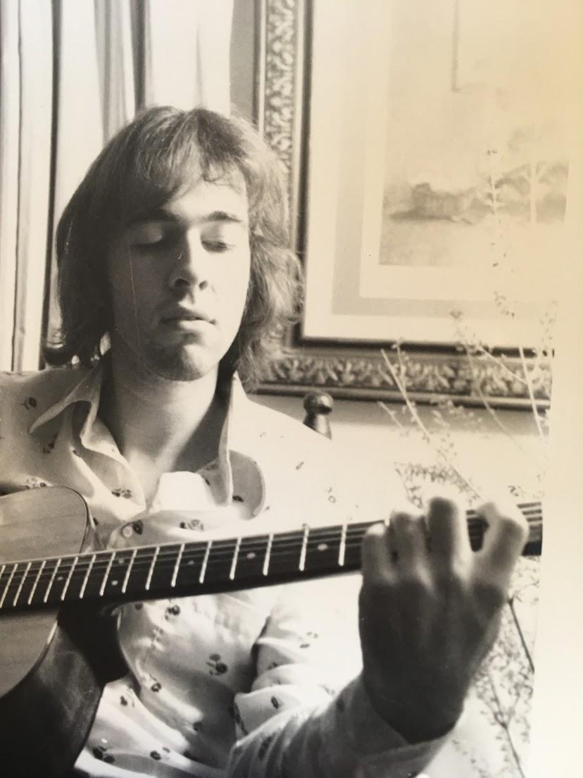 Jory at 23, playing his guita…