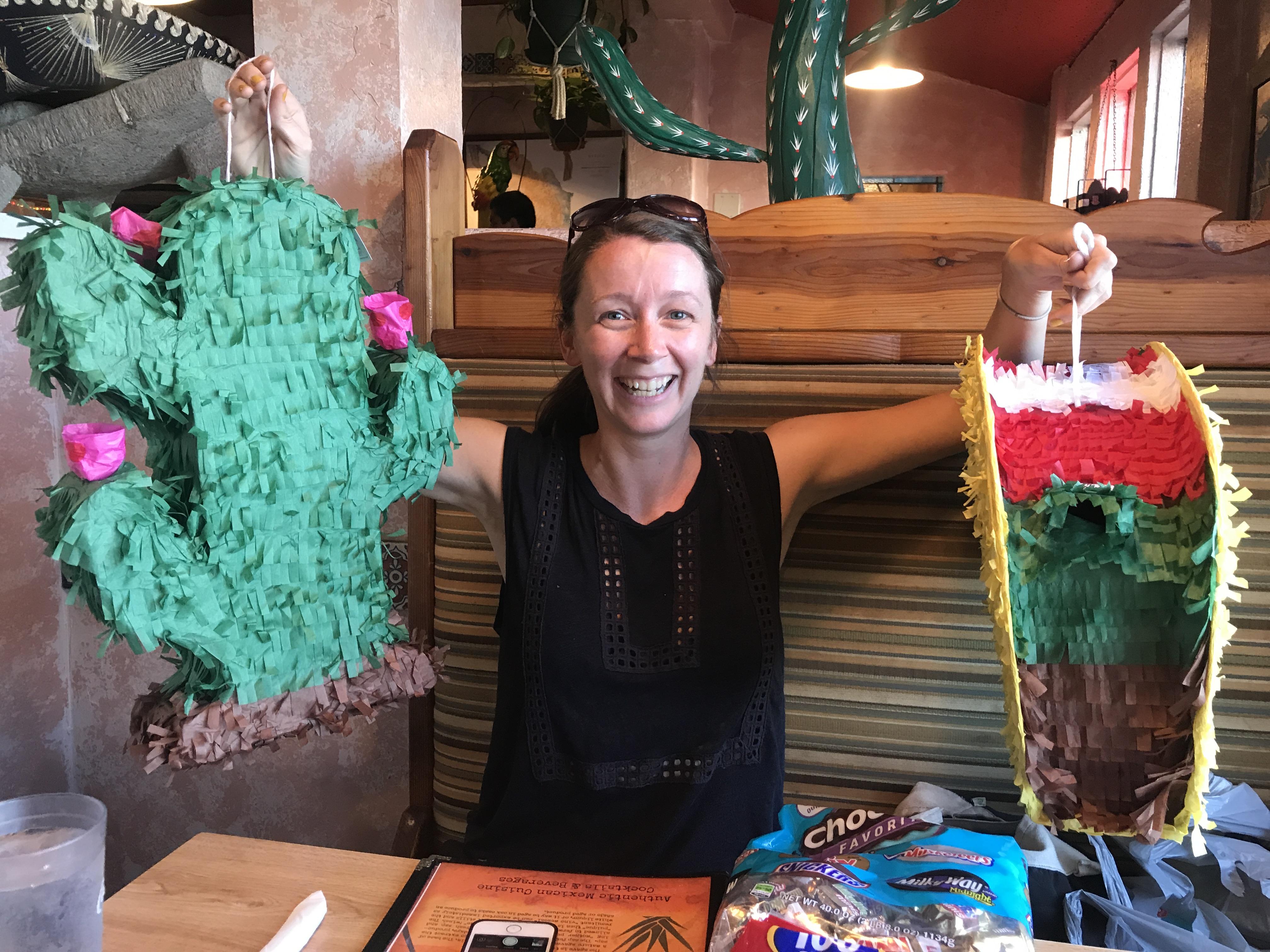 Emma showing off the piñatas …