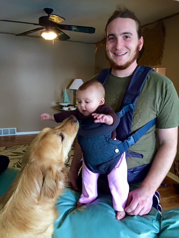 Mason giving baby Bella a kiss