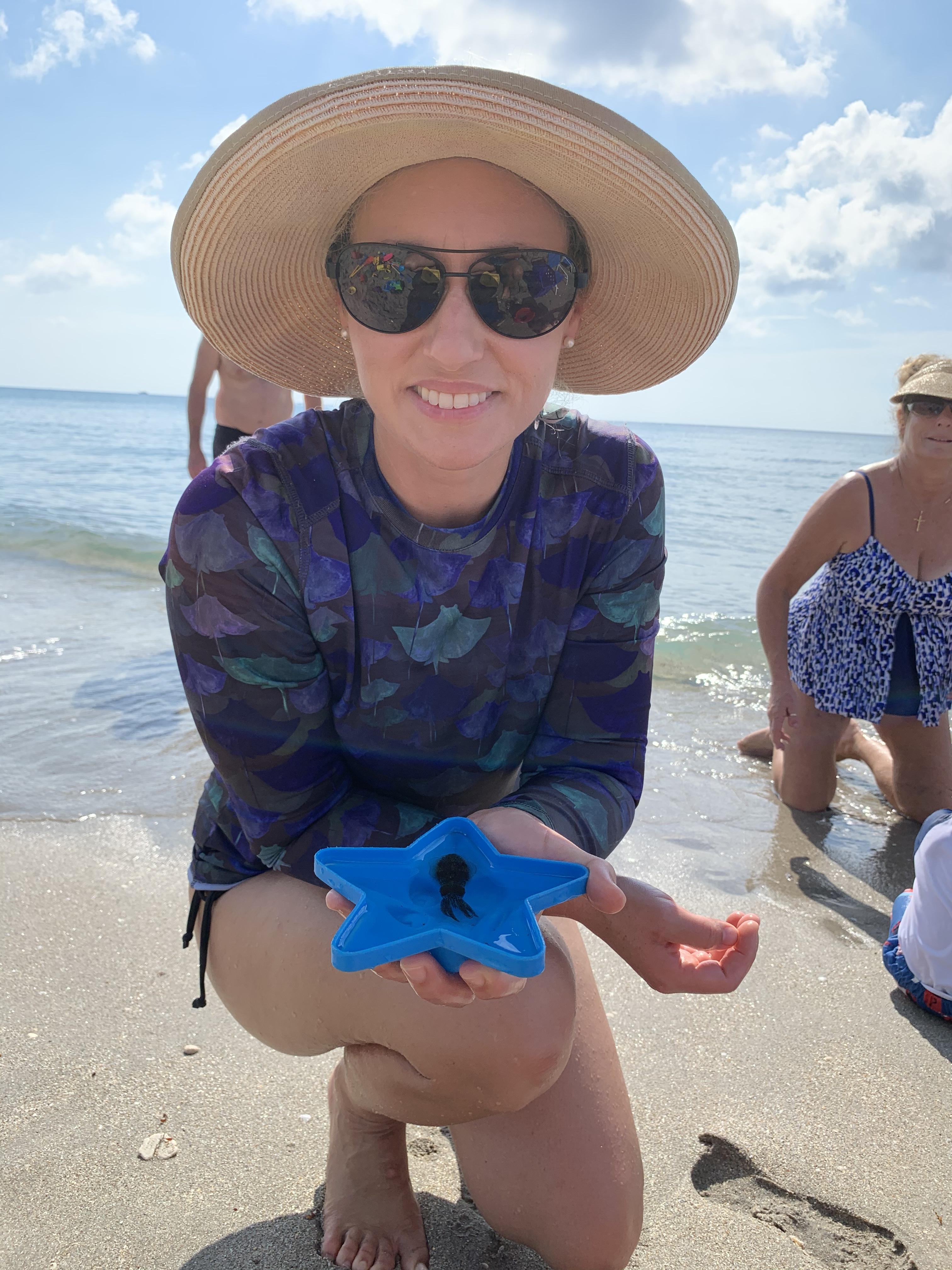 Krystal at the beach with a s…