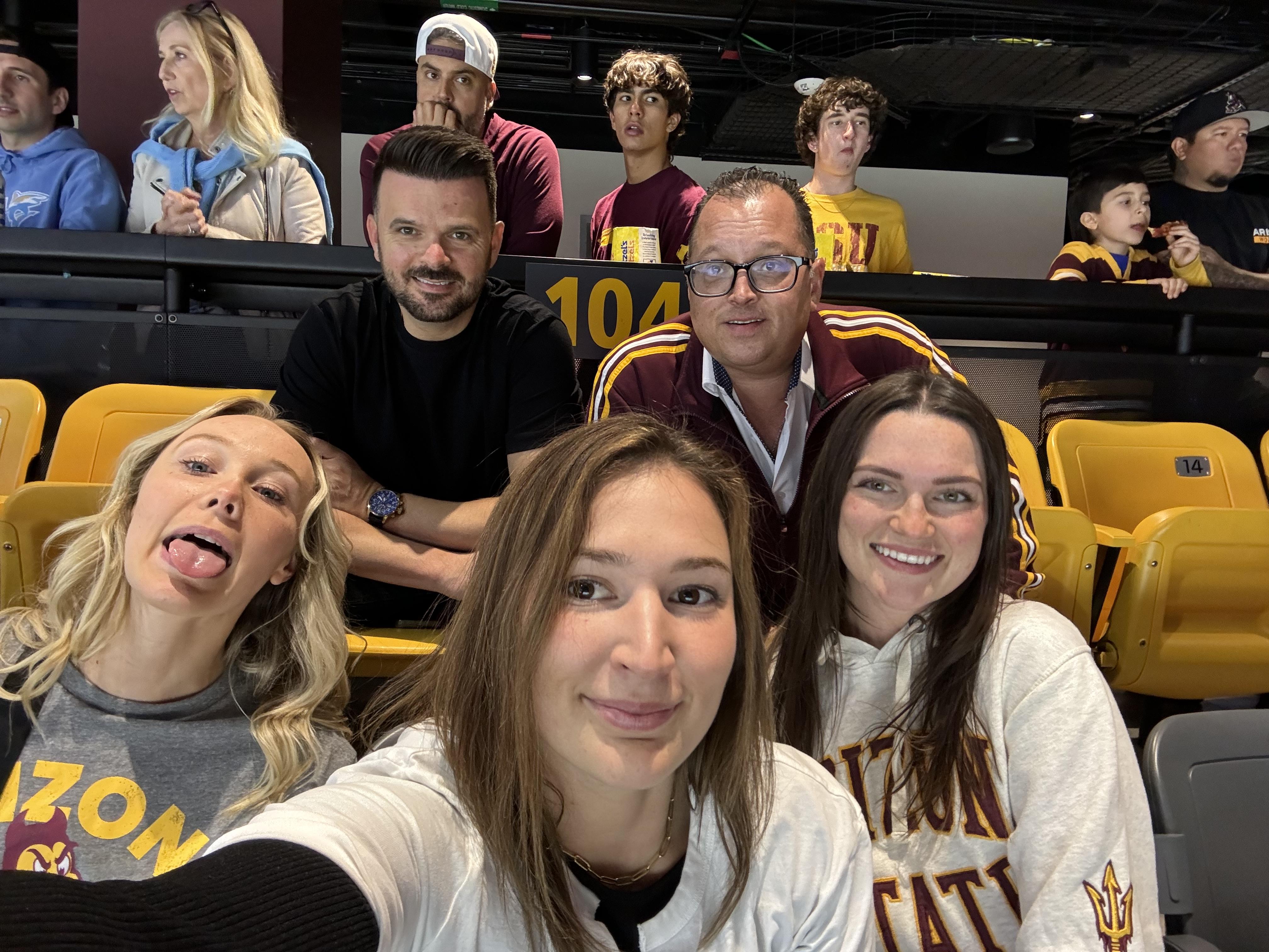 Josh and the girls at a hocke…
