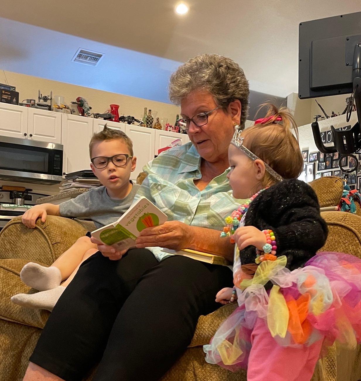Grandma reading to Caleb and …